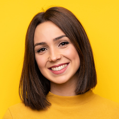 Woman in yellow shirt smiling